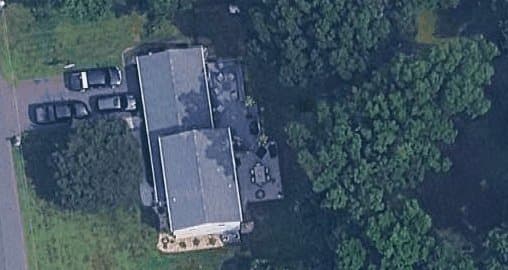 Satellite view of the home with roof outline traced for gutter measurement